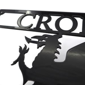 Closeup of Arwydd Metel Du Draig Cymreig Dwyieithog 'Croeso Welcome' Welsh Dragon Bilingual Black Metal House Sign in Welsh & English