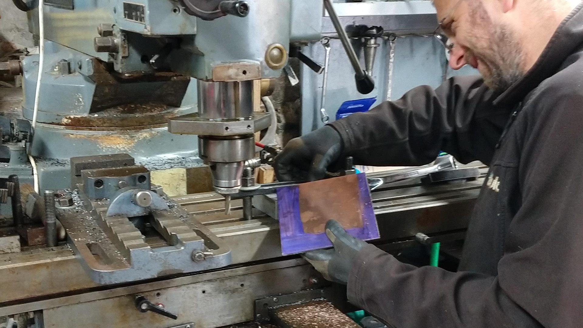 Nick squaring up the bronze plate for Nat Bowen's "Black Diamond" gallery plaque on our Beavermill vertical mill