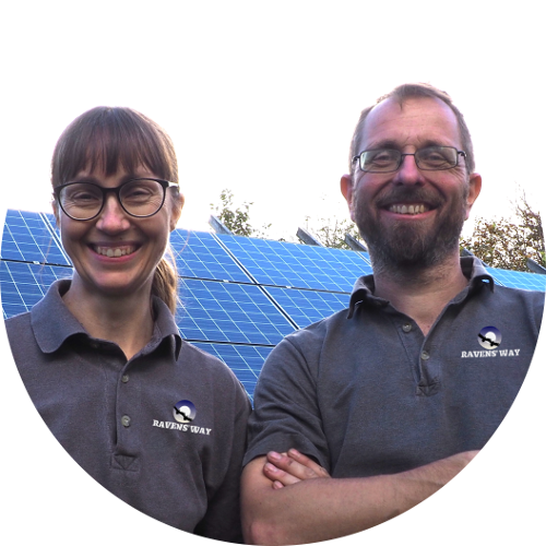 A smiling Jo and Nick of Ravens' Way with their solar photovoltaic panels