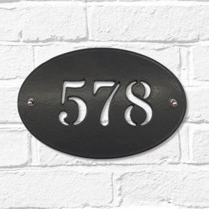 Classic oval metal house number sign in black steel