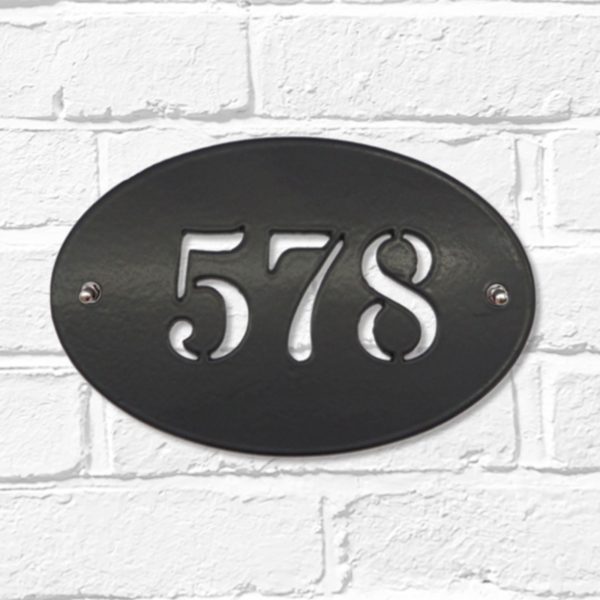 Classic oval metal house number sign in black steel