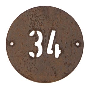 Modern round metal house number in rusted industrial look Corten weathering steel