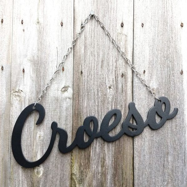 Croeso hanging black metal decorative Welcome in Welsh sign with stainless steel hanging chain. This is Ravens' Way Metalworks' Ukraine crisis fundraiser. We will donate 100% of all profits and labour costs from this product to Ukraine Red Cross.