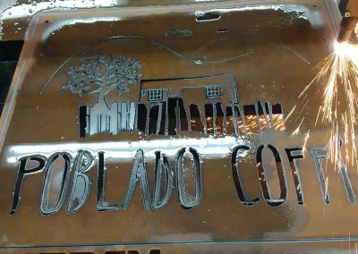 Poblado Coffi's COR-TEN weathering steel sign being cut on our CNC plasma cutter