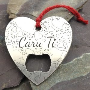 Calon "Caru Ti" Welsh Love You heart stainless steel bottle opener on a Welsh slate