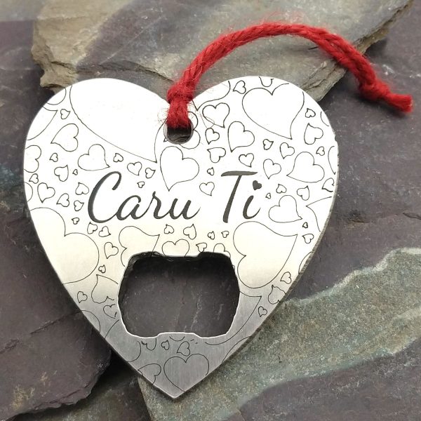 Calon "Caru Ti" Welsh Love You heart stainless steel bottle opener on a Welsh slate