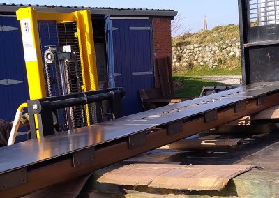 Loading the monolith signs for HIE Inverness onto specialist transport