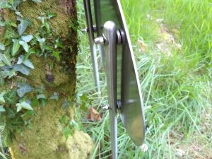 Closeup of the back of the sign showing the tubular stainless steel posts with solid end caps, fixings and hidden studs