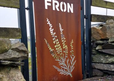 Mountain-shaped CORTEN weathering steel gate