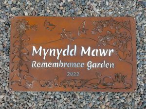 Completed COR-TEN weathering steel and stainless steel commemorative garden sign for NHS Wales