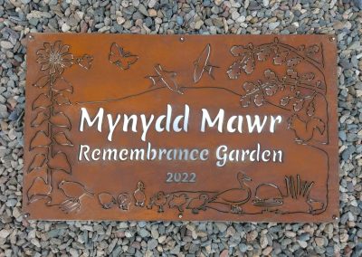 Completed COR-TEN weathering steel and stainless steel commemorative garden sign for NHS Wales