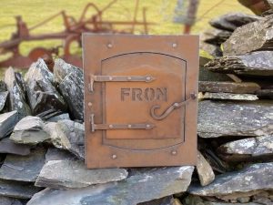 Vintage post box restoration in CORTEN weathering steel with mountain-shaped detailing on door