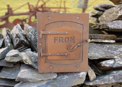 Vintage post box restoration in CORTEN weathering steel with mountain-shaped detailing on door