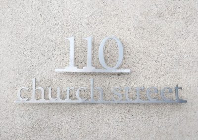 Silhouette-cut Stainless Steel House Sign On A Bottom Bar