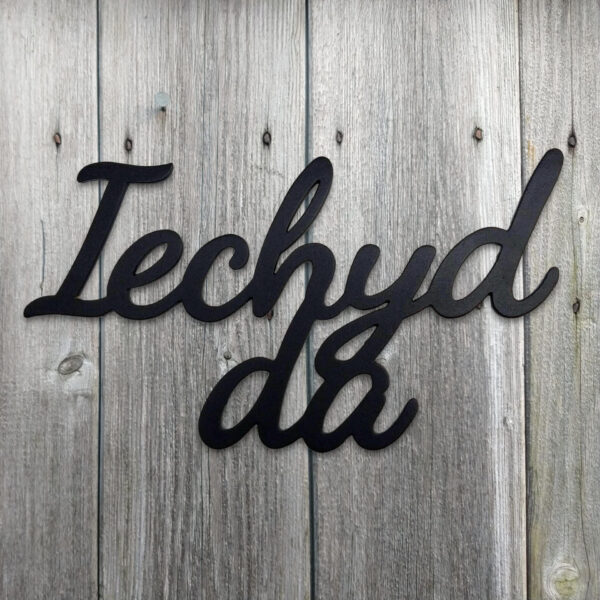 Iechyd da hanging black metal decorative "Cheers!" in Welsh sign.